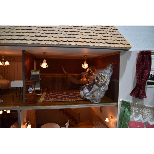 361 - A six bedroom doll's house, complete with garden, electrics, dolls, furniture and accessories and va... 