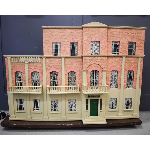 377 - A large Victorian dolls house, of generous proportions, modelled in the Queen Anne style, on three f... 