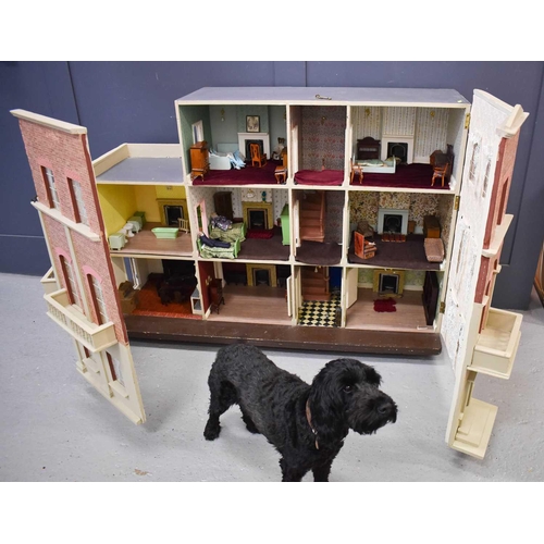 377 - A large Victorian dolls house, of generous proportions, modelled in the Queen Anne style, on three f... 