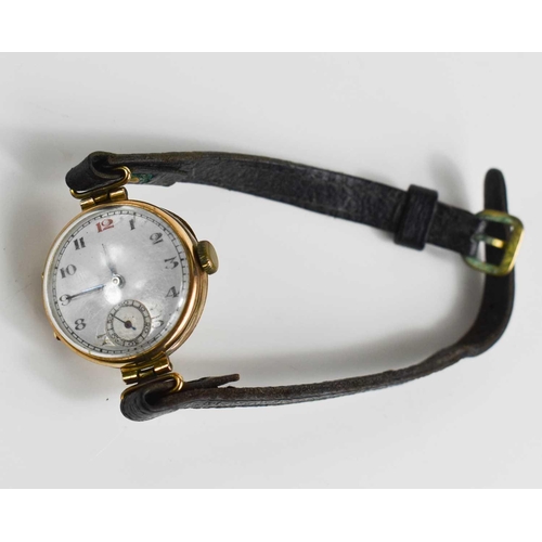 38 - A 9ct gold 1920s ladies wristwatch, the Arabic dial with a subsidiary seconds dial, with a black lea... 