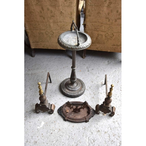 381 - A pair of antique cast iron andirons together with ashtray stand and a Victorian boot scraper.