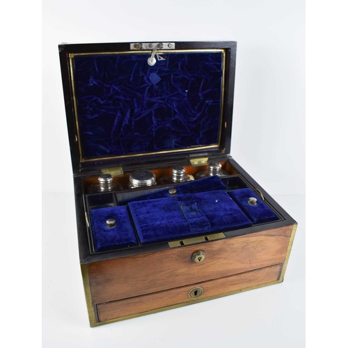 39 - A 19th century campaign style Rosewood vanity case, with blue velvet lined and fitted interior, cont... 