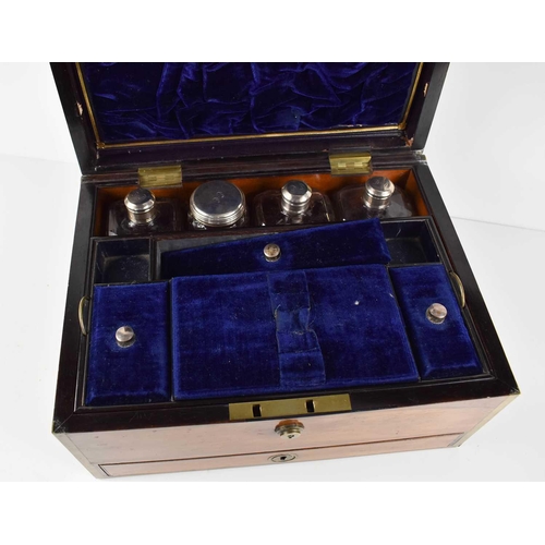 39 - A 19th century campaign style Rosewood vanity case, with blue velvet lined and fitted interior, cont... 