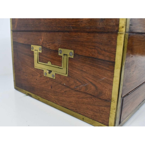 39 - A 19th century campaign style Rosewood vanity case, with blue velvet lined and fitted interior, cont... 