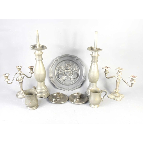 391 - A pair of 19th century pewter candlesticks, 52cm high together with a pair of Philip Ashberry & Sons... 