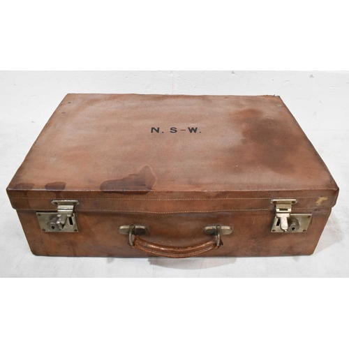 393 - A 19th century gentleman's travelling suitcase, containing eight silver bottles, London 1907, in bro... 