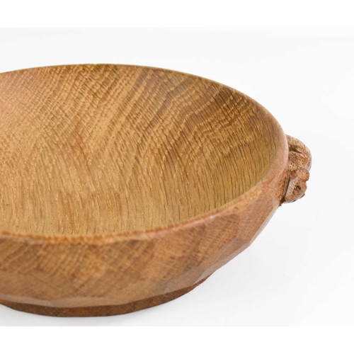 404 - A Robert Thompson 'Mouseman' oak nut bowl, with carved signature mouse to the edge, 16cm diameter.