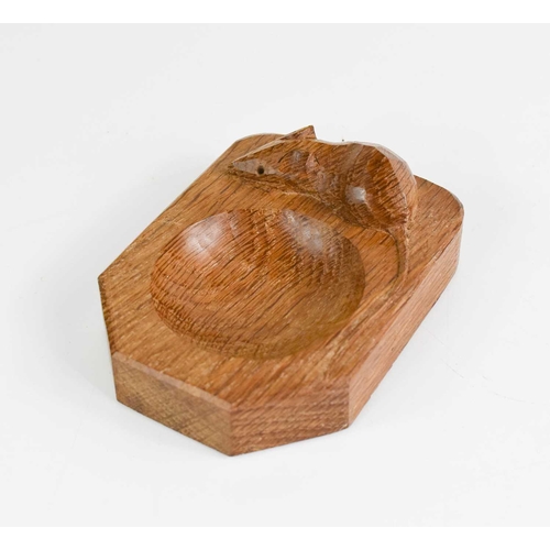 405 - A pair of Robert Thompson Mouseman ashtrays, and a napkin ring, each carved with a signature mouse.