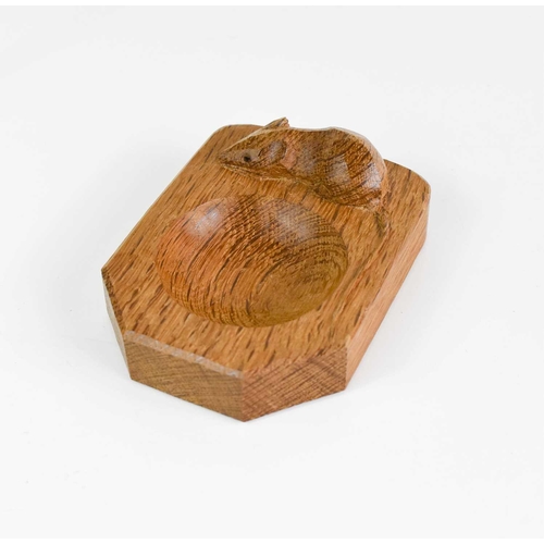 405 - A pair of Robert Thompson Mouseman ashtrays, and a napkin ring, each carved with a signature mouse.