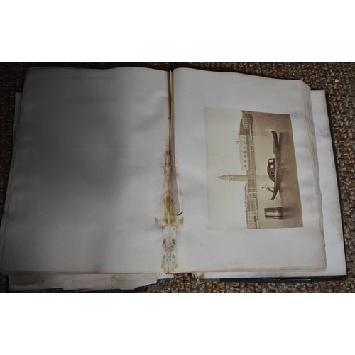 418 - A very large late Victorian scrapbook, filled with prints of various works of art and places, with h... 