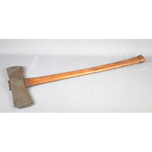 521 - A Canadian double headed woodmans axe with wooden shaft.