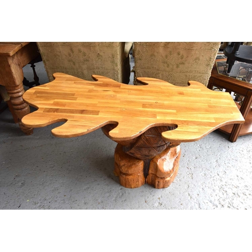 534 - A handmade oak leaf shaped table, 123cm long, 58cm tall.