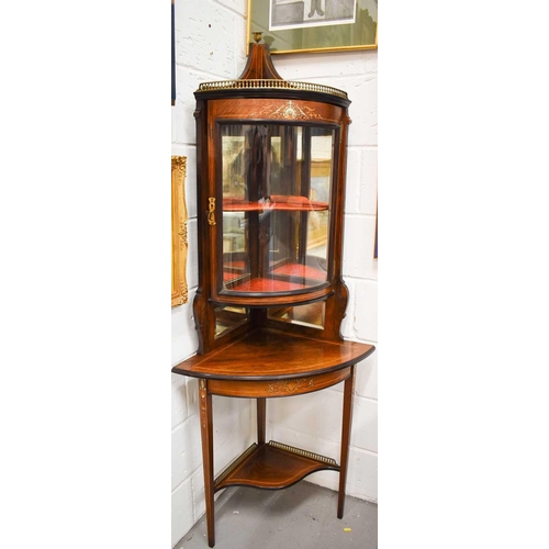 535 - An Edwardian rosewood and marquetry inlaid corner cabinet, witha bow front glazed foor, satinwood li... 