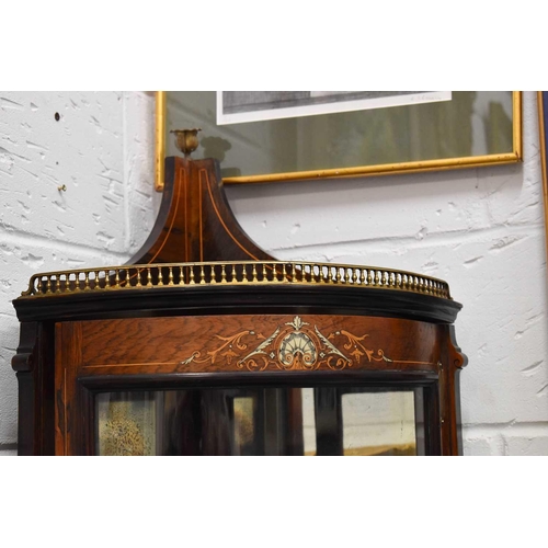 535 - An Edwardian rosewood and marquetry inlaid corner cabinet, witha bow front glazed foor, satinwood li... 