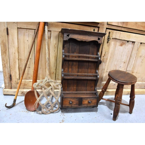 543 - An antique oak stool with turned legs and cross form stretcher together with a large treen porridge ... 