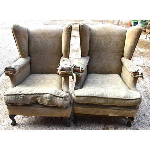 544 - A apir of Victorian wingback armchairs, raised on oak ball and claw feet together with a childs tub ... 