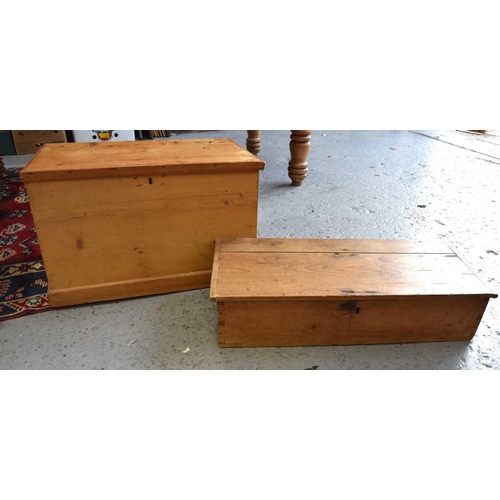 555 - Two antique pine boxes, both with twin iron handles to the sides, the longest measuring 19cm by 83cm... 