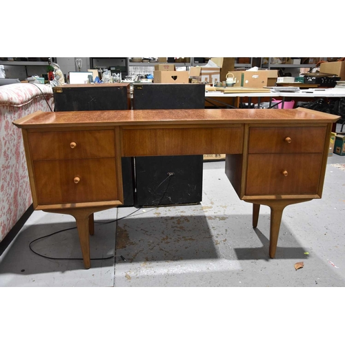 558 - A Mid-Century teak effect dressing table, mirrors included.