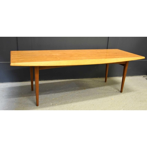 564 - A Mid-Century Gordon Russell teak coffee table, 40cm high by 122cm wide.