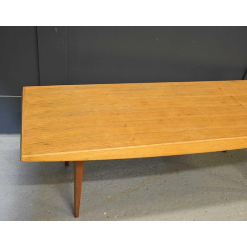 564 - A Mid-Century Gordon Russell teak coffee table, 40cm high by 122cm wide.