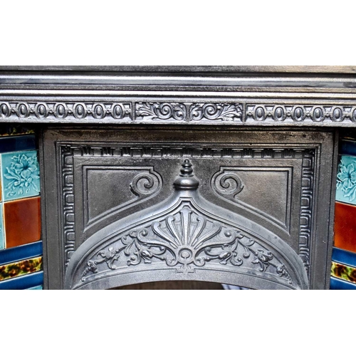 566 - A cast iron fireplace with tile inset, circa 1912.