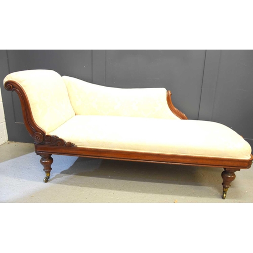 574 - A Victorian mahogany framed Chaise Lounge, scrolling back, cream fabric upholstery, 38cm seat height... 