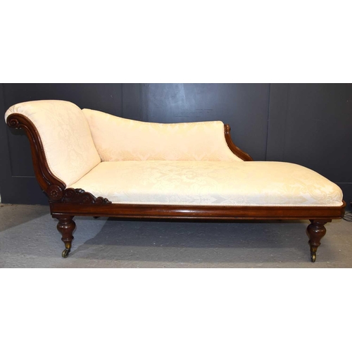 574 - A Victorian mahogany framed Chaise Lounge, scrolling back, cream fabric upholstery, 38cm seat height... 