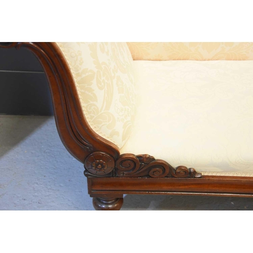 574 - A Victorian mahogany framed Chaise Lounge, scrolling back, cream fabric upholstery, 38cm seat height... 