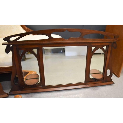 575 - An Arts and Crafts oak overmantle mirror in the style of Ashbee, together with a mahogany overmantle... 