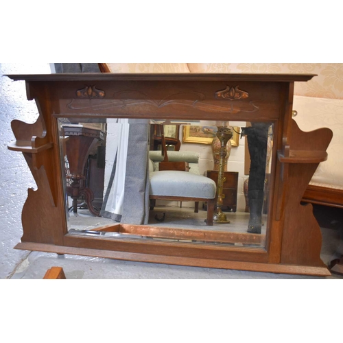 575 - An Arts and Crafts oak overmantle mirror in the style of Ashbee, together with a mahogany overmantle... 