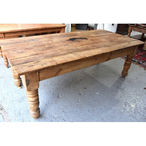 577 - A antique pine kitchen / dining table with seven plank top above large turned legs, 76cm by 214cm by... 