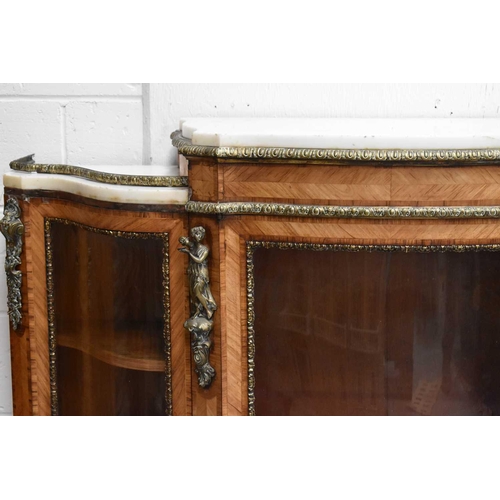 582 - A French 19th century walnut, ormolu and marble topped credenza, with shaped bow front, central glaz... 