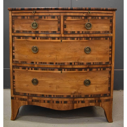 584 - A 19th century bow front chest of drawers, cross banded in coromandel, comprising two short over two... 