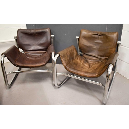 586 - A pair of Mid Century Maurice Burke Alpha Sling armchairs For Pozza, in tan leather with a chrome fr... 