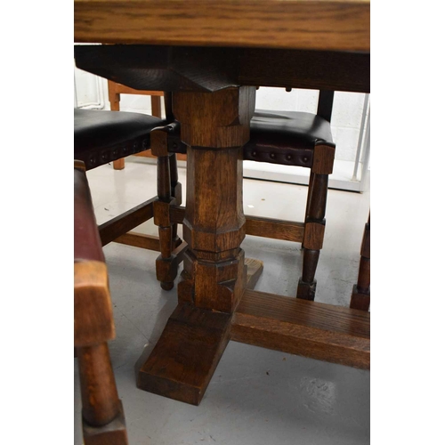 589 - Leon Keogh 'Owlman' oak dining table with three plank top, with carved owl logo to the trestle form ... 