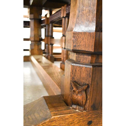 589 - Leon Keogh 'Owlman' oak dining table with three plank top, with carved owl logo to the trestle form ... 