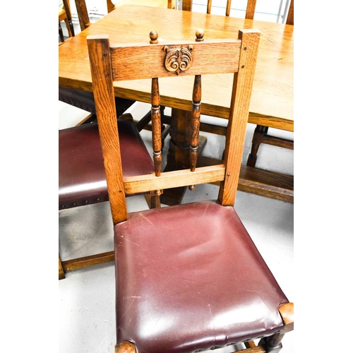 589 - Leon Keogh 'Owlman' oak dining table with three plank top, with carved owl logo to the trestle form ... 