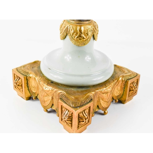 96 - A 19th century French Pâte-sur-pâte and ormolu twin handled urn, pale green with white overlay, the ... 