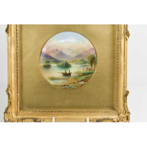 98 - A porcelain plaque by G Micklewright, painted with a view of Rydal Water, signed, 12cm diameter, the... 