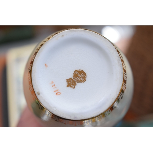 201 - A Coalport part tea service in the 2668 pattern, together with Royal Crown Derby pair of coffee cans... 