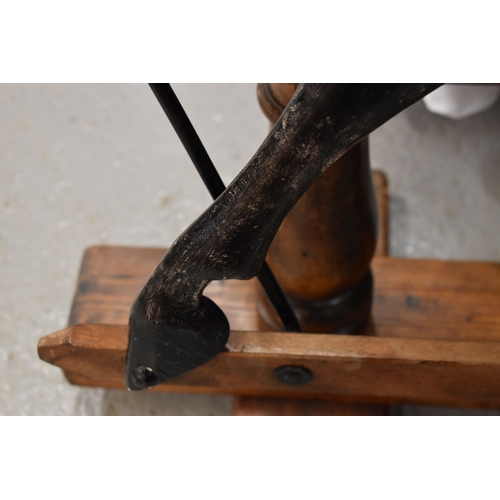 285 - A vintage rocking horse on a pine stained base. the dapple grey hand painted horse with leather sadd... 