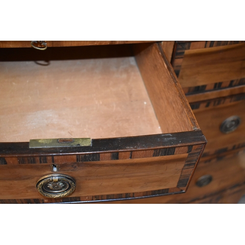 584 - A 19th century bow front chest of drawers, cross banded in coromandel, comprising two short over two... 