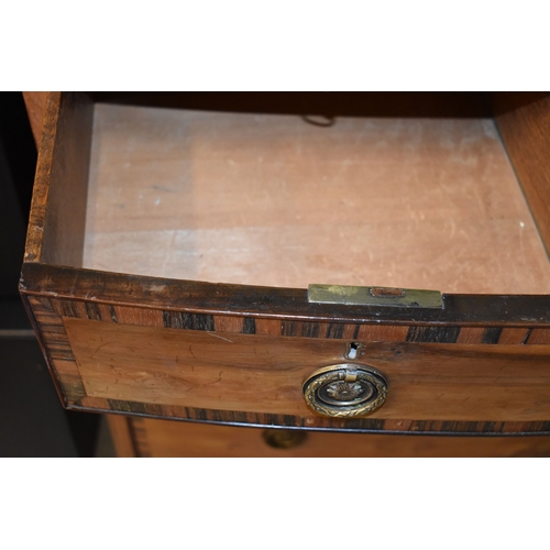 584 - A 19th century bow front chest of drawers, cross banded in coromandel, comprising two short over two... 