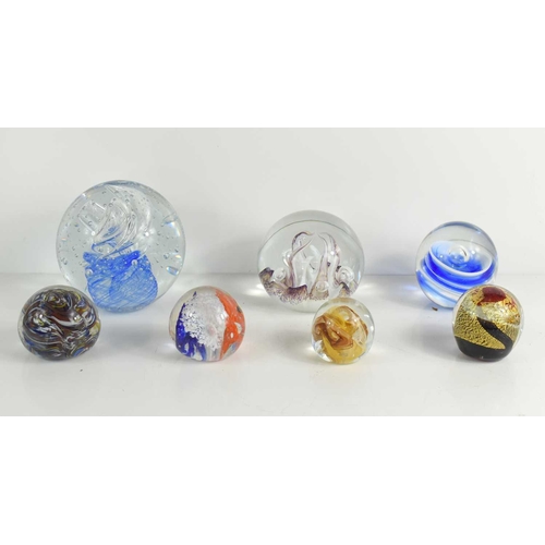 132 - A Selkirk glass paperweight together with others of different size and form. (7)