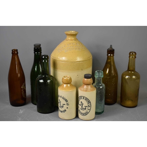 133 - A group of vintage glass and stoneware bottles all for Bullard and Sons of Norwich, including a larg... 