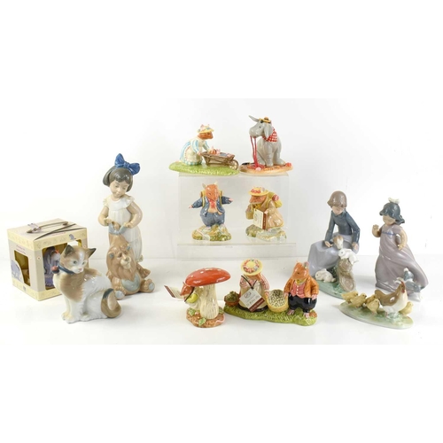 146 - A group of boxed Royal Doulton and Lladro figurines to include Winnie the Pooh, Bramley Hedge, Lladr... 