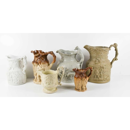 154 - A group of six Victorian stoneware glazed jugs, modelled with figural scenes and other decoration. (... 