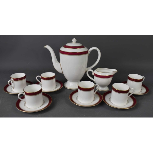 156 - A Royal Worcester part coffee service in the Howard pattern, comprising six cups, saucers, milk jug ... 