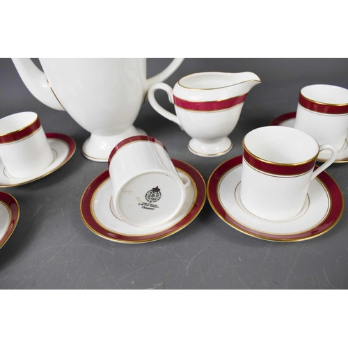 156 - A Royal Worcester part coffee service in the Howard pattern, comprising six cups, saucers, milk jug ... 