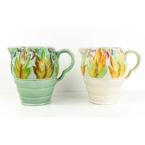 160 - A pair of Clarice Cliff jugs, with floral decoration to both, one with pale green ground.